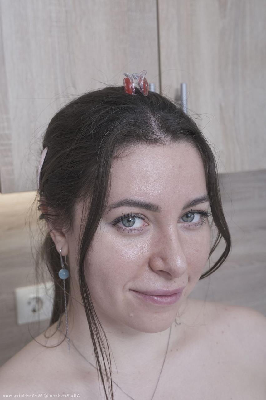 20P Brunette Russian Ally Breelsen strips in the kitchen and rubs her hairy twat