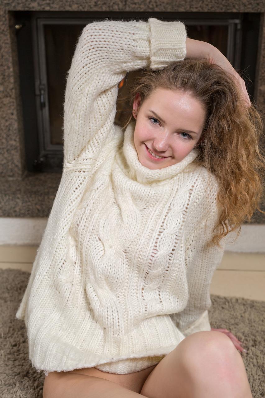 20P Cute Belarusian Faina Bona posing naked on the carpet by the fireplace