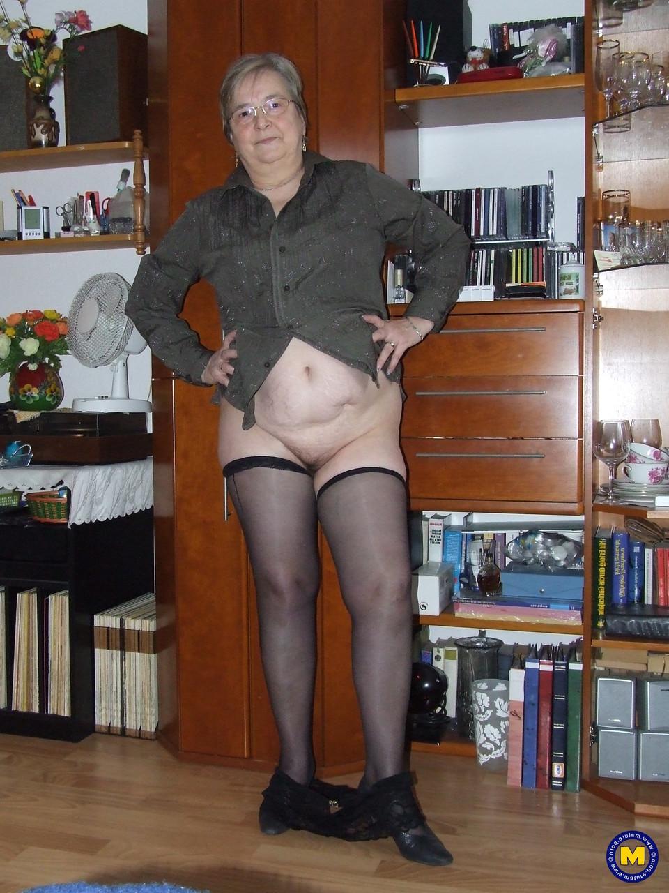 20P Chubby granny with glasses Sybille stripping naked & toying her fat pussy