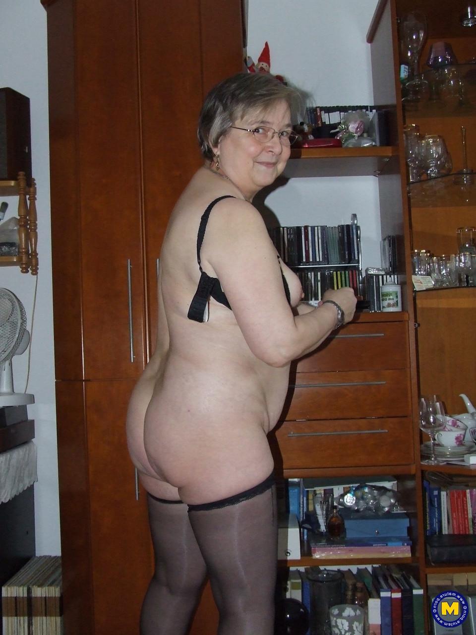 20P Chubby granny with glasses Sybille stripping naked & toying her fat pussy