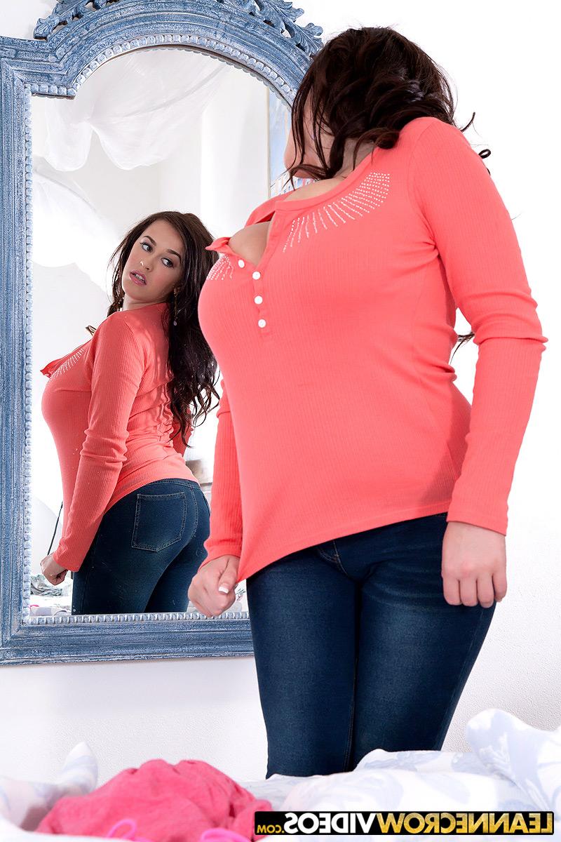 16P Curvy MILF Leanne Crow admires herself in a mirror before baring her knockers