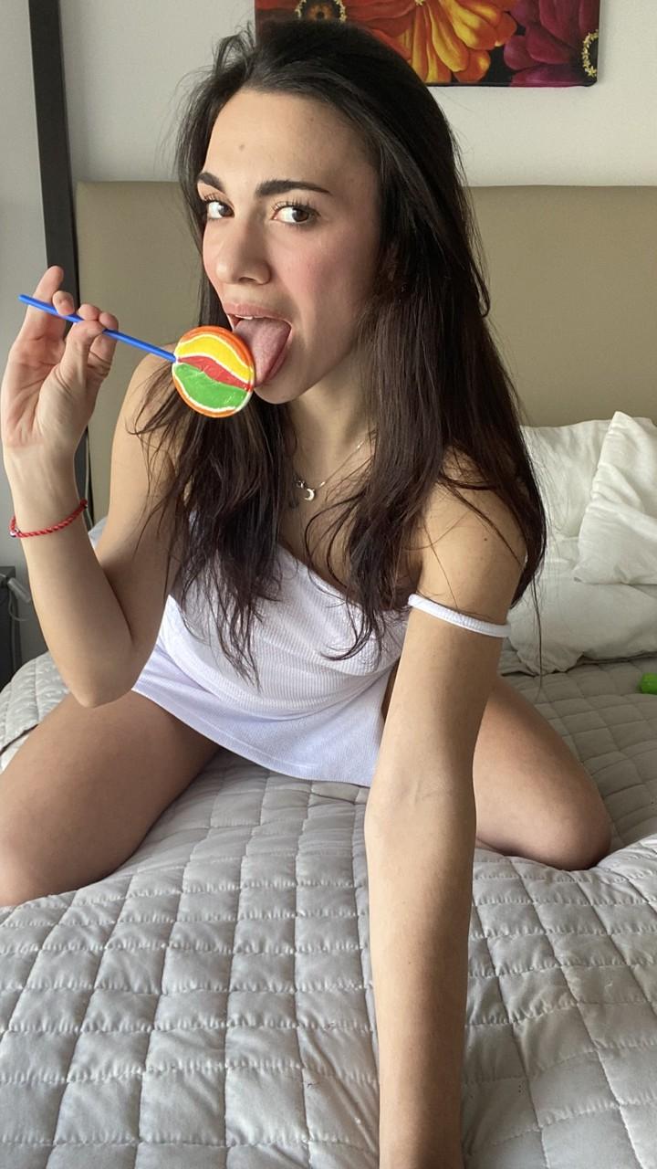 11P Beautiful brunette Madison Light flashes her natural tits on her bed