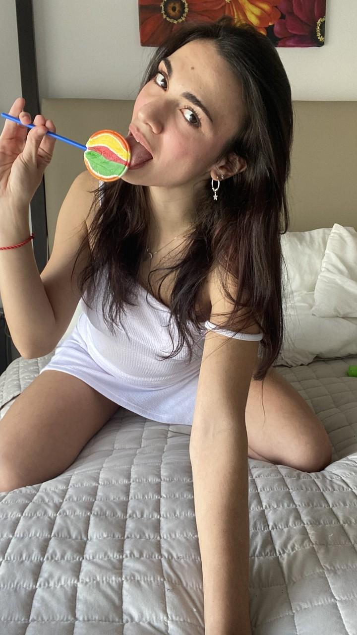 11P Beautiful brunette Madison Light flashes her natural tits on her bed