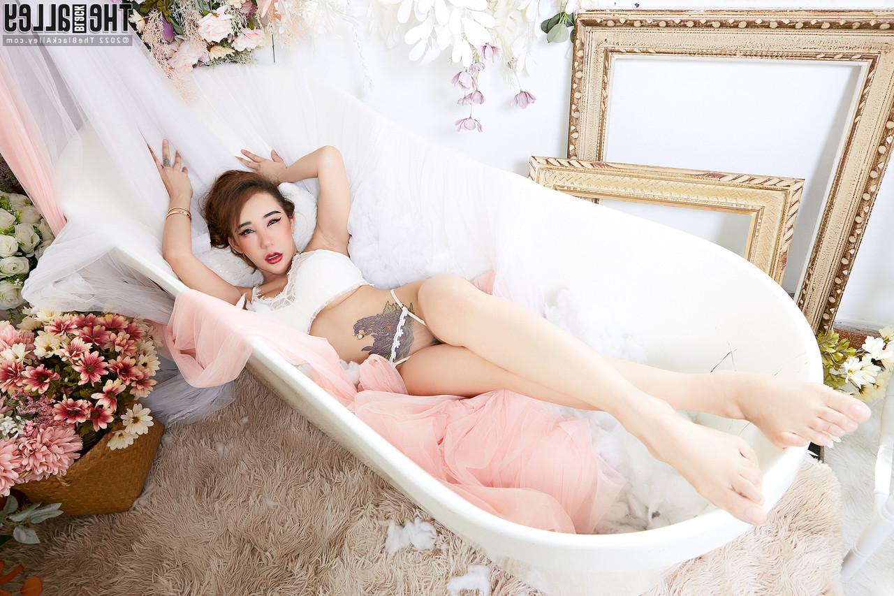 16P Hot Asian redhead Rayna with enhanced tits goes nude in a bathtub