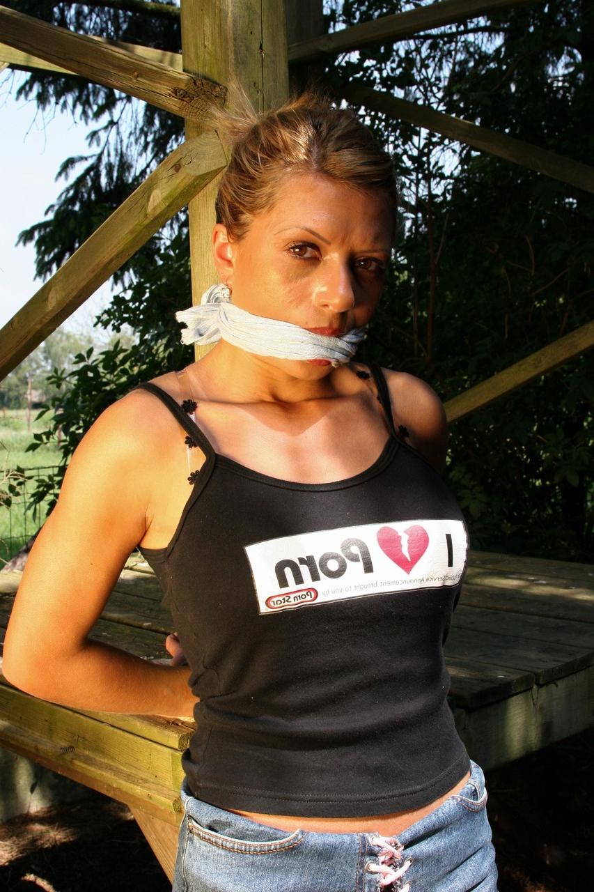20P Submissive babe with big tits Cory gets tied up and left on a trampoline