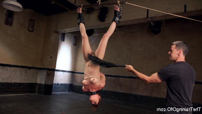 15P Nude redhead is subjected to hard slave training while suspended upside down