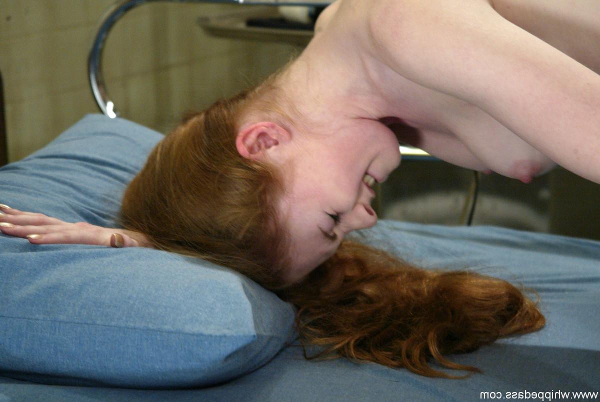20P Redheaded slave Nicole Scott gets fucked doggystyle by lezdom Harmony
