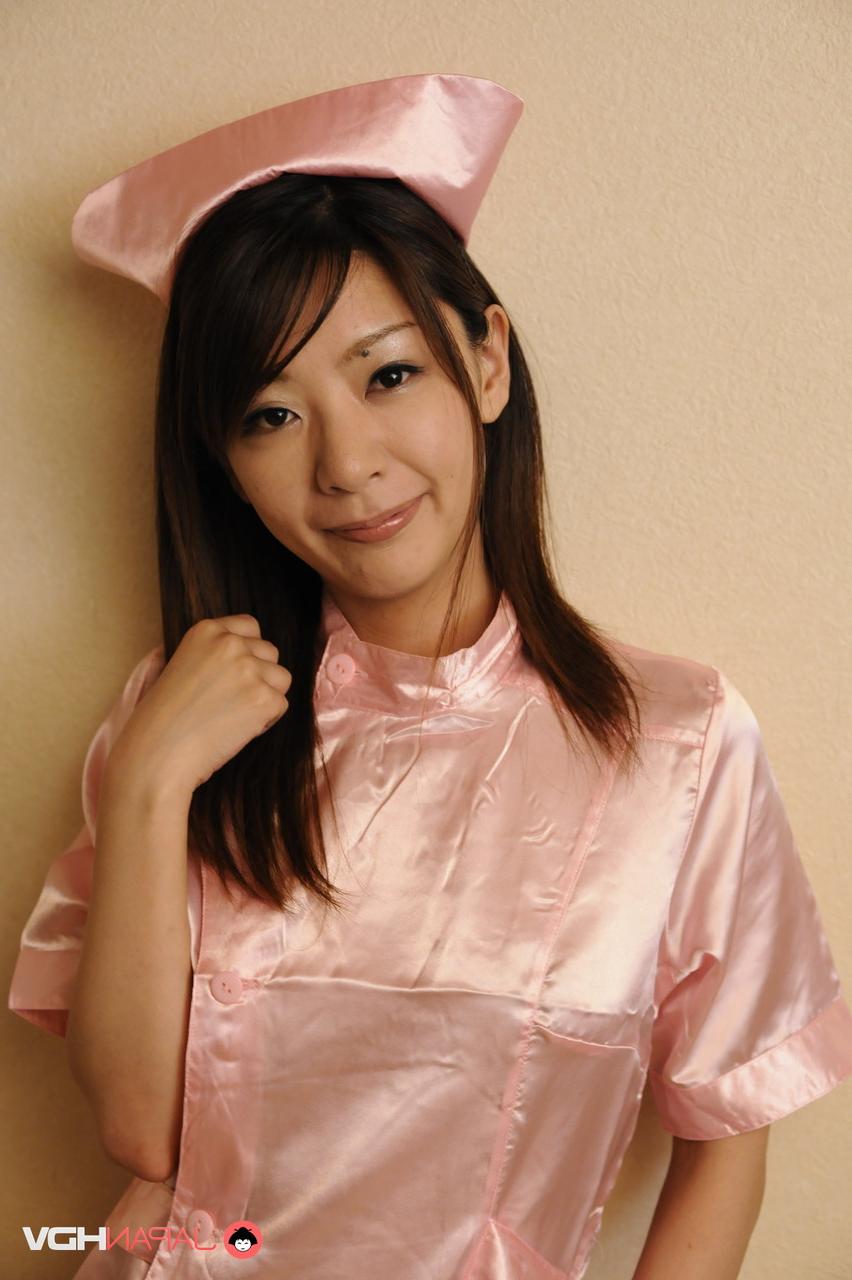 15P Cute Japanese girl Tomomi Matsuda frees her tits and bush from her clothing