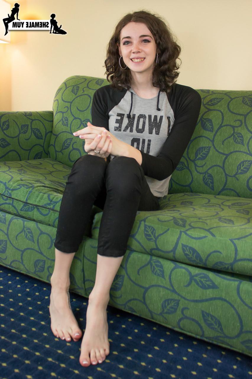 15P Dark-haired shemale Sasha Skyes displaying her sensitive feet, cock & booty