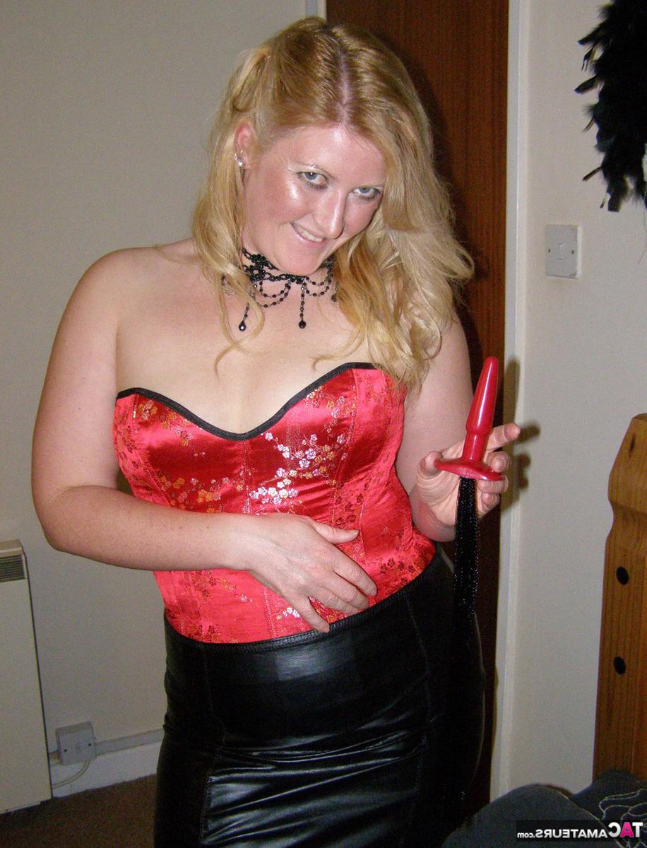 16P Strawberry blonde Samantha inserts a butt plug while wearing mesh nylons