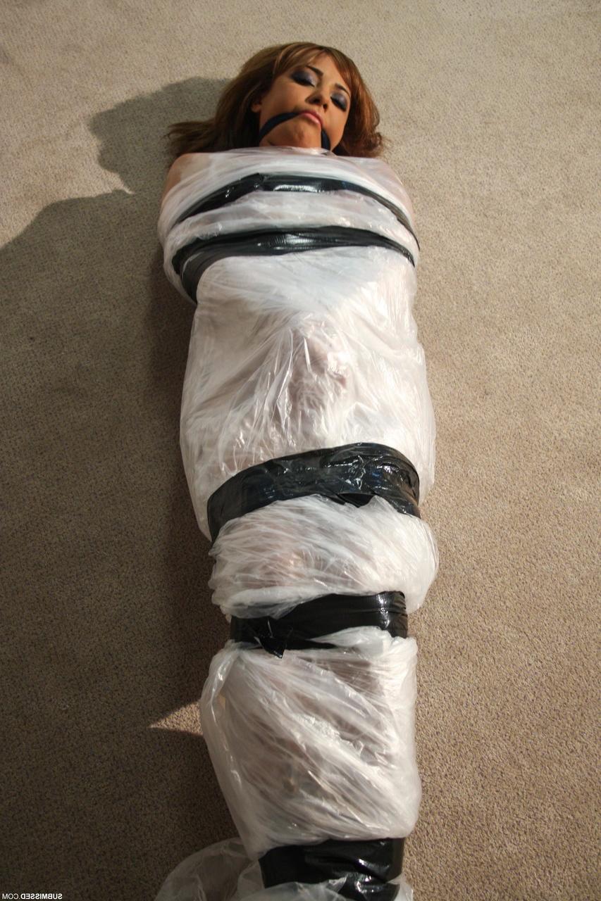 19P Poor slut Kayla moans while being covered in special plastic film