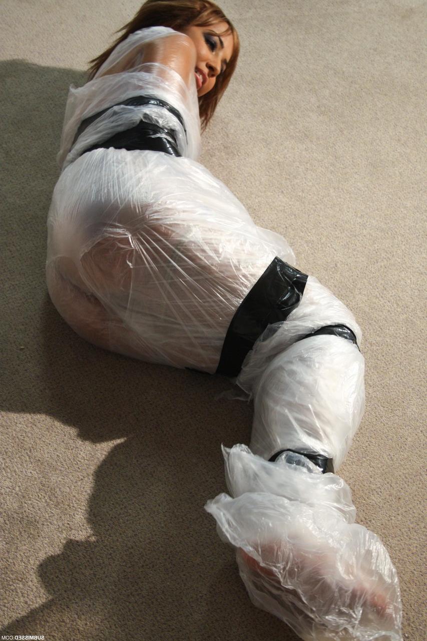 19P Poor slut Kayla moans while being covered in special plastic film