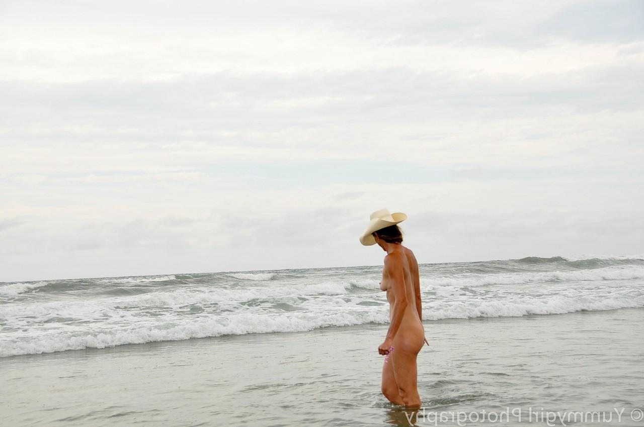 20P Tall MILF with a hat Sofie Marie posing butt naked on the sandy beach