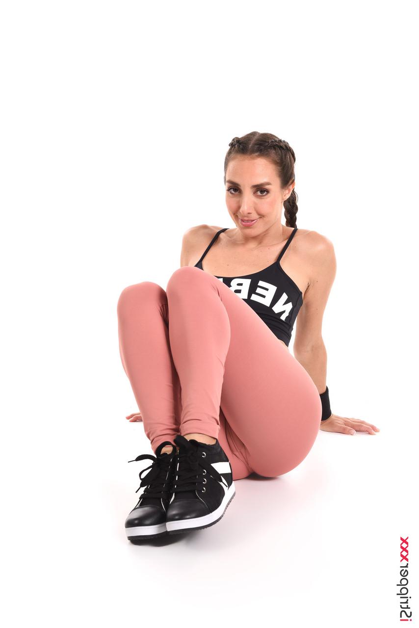 15P Sweaty brunette Ana B wets her athletic wear before masturbating in the nude