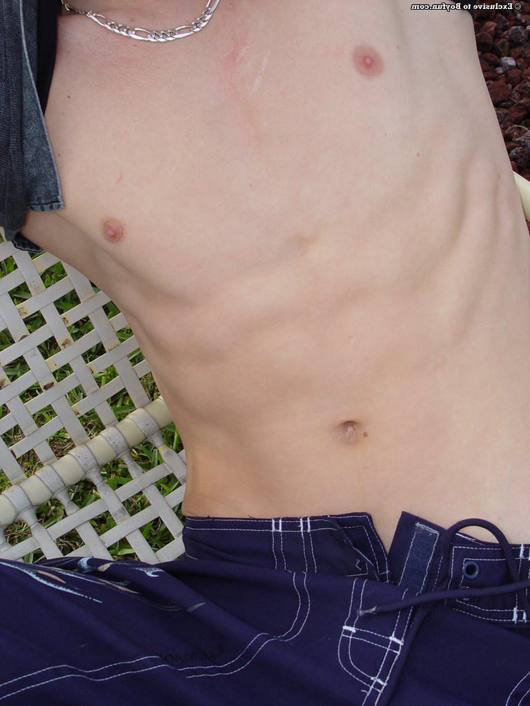 20P Horny gay hottie Alex stripping poolside and stroking his huge boner
