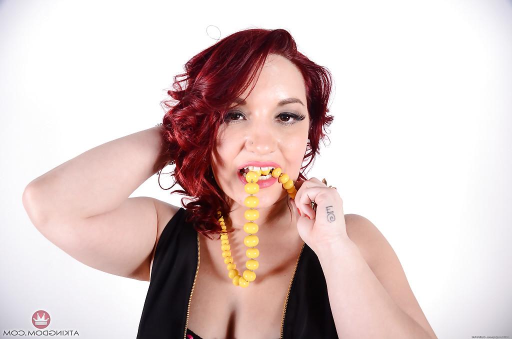 16P Older redhead fatty with tattoos unleashing big natural breasts