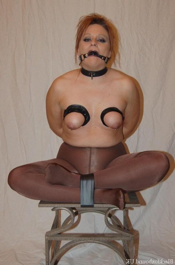 16P Redheaded chick gives a BJ with her boobs in bondage and restrained as well