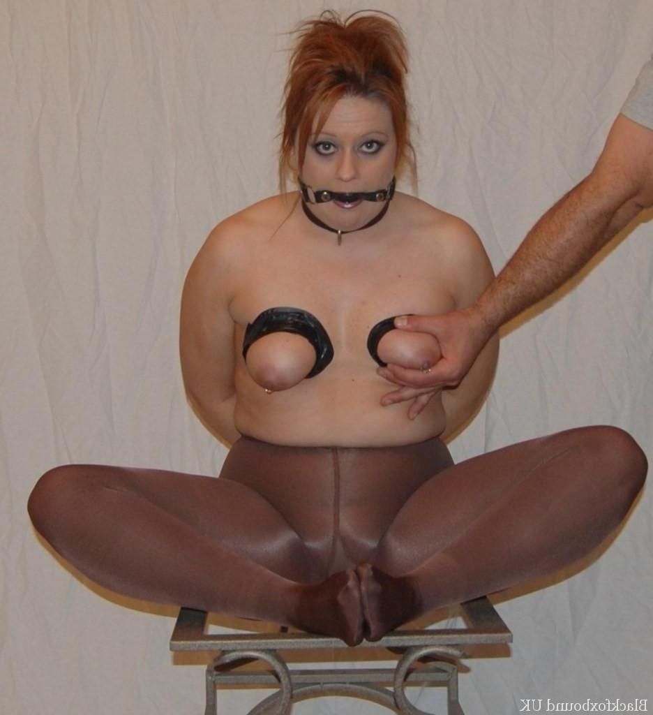 16P Redheaded chick gives a BJ with her boobs in bondage and restrained as well