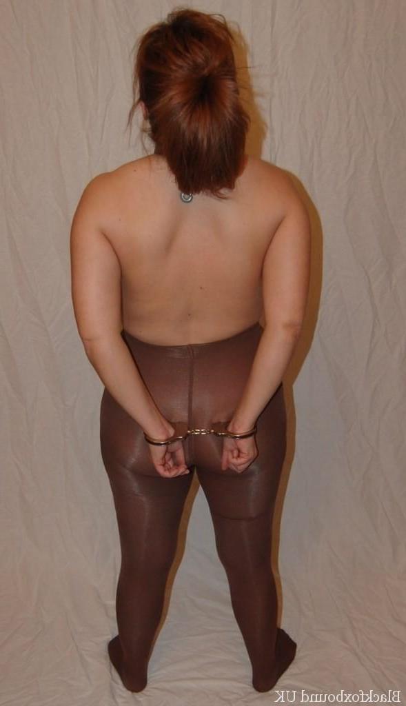 16P Redheaded chick gives a BJ with her boobs in bondage and restrained as well