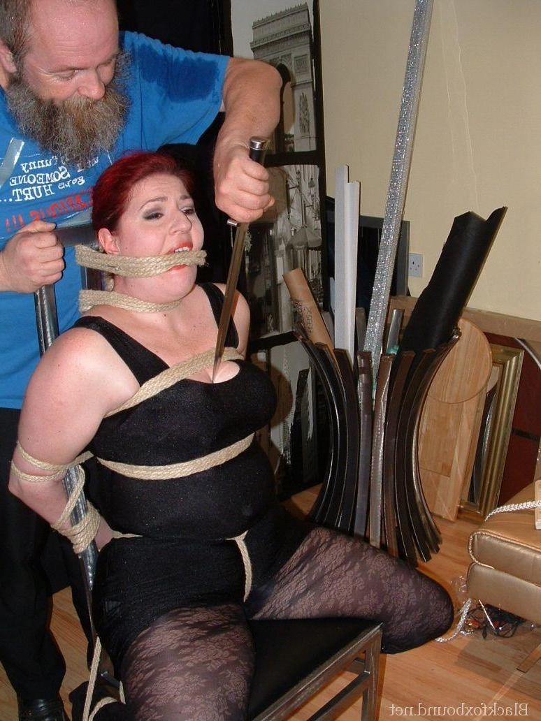 16P Overweight redhead is threatened with a knife while tied to a chair