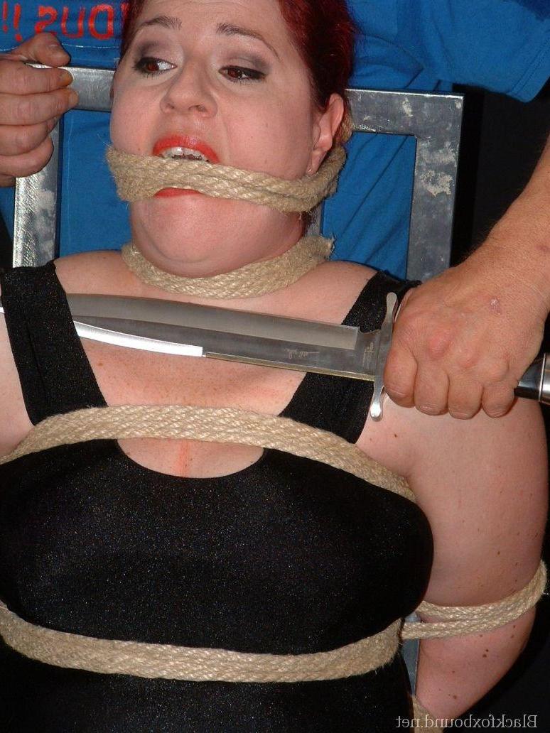 16P Overweight redhead is threatened with a knife while tied to a chair