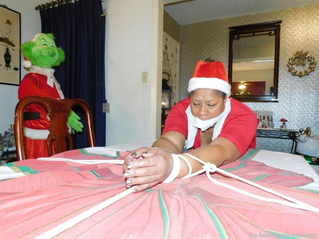 16P Ebony fatty is tied over a table at Christmas with her underwear showing