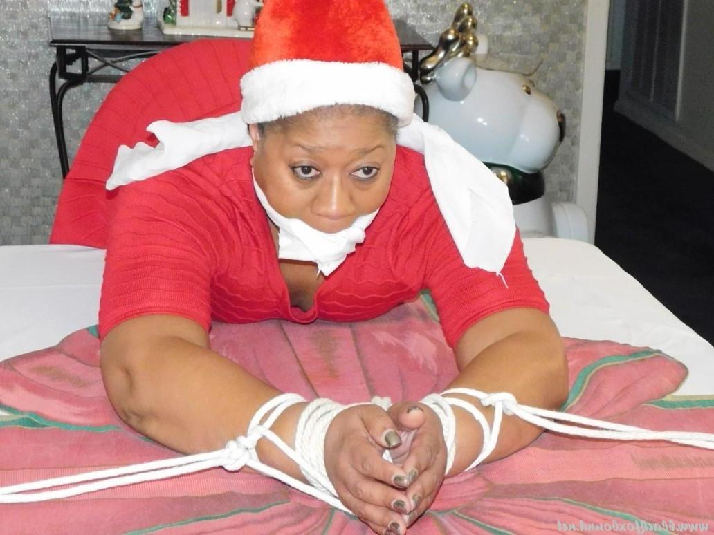 16P Ebony fatty is tied over a table at Christmas with her underwear showing
