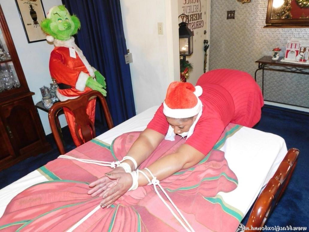 16P Ebony fatty is tied over a table at Christmas with her underwear showing