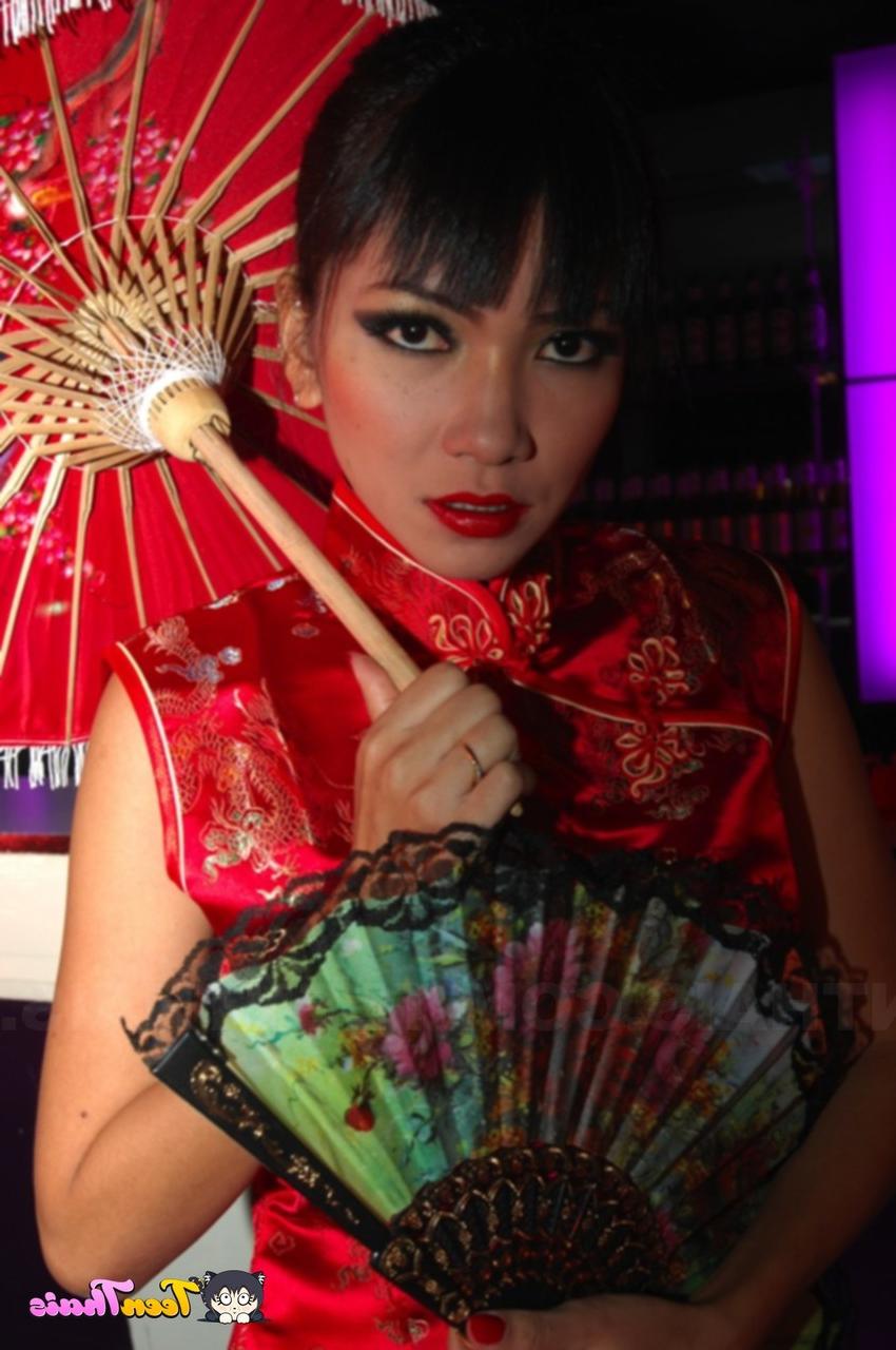 20P Thai lesbians Mintra and Sherri lose their traditional outfits & pose naked
