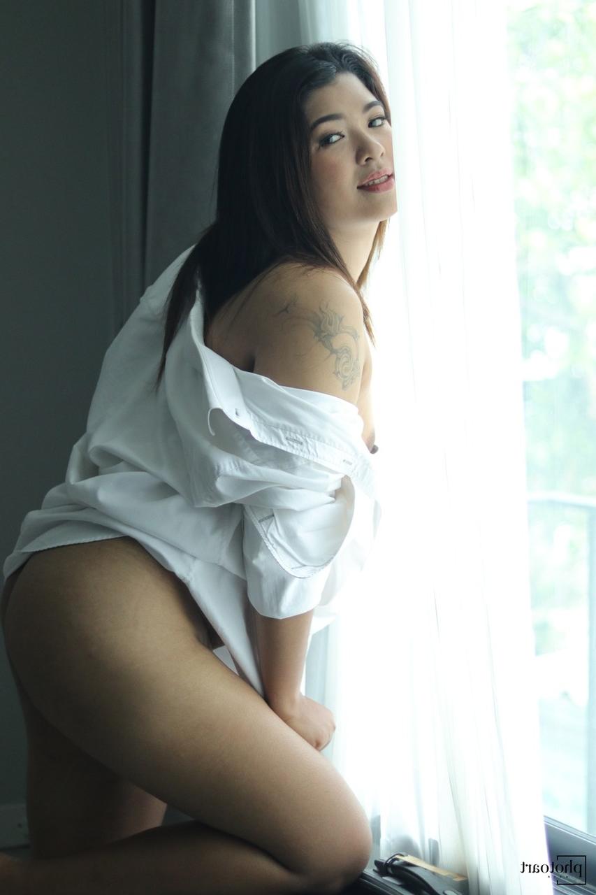 14P Beautiful Asian babe flashes her tiny tits while teasing in a shirt