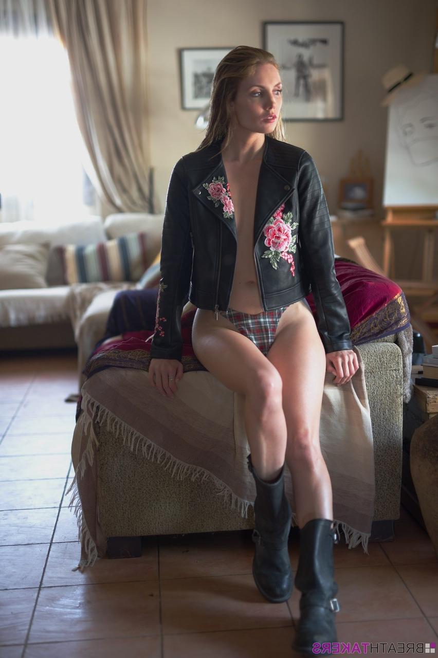 12P Glamour model Anuska bares a breast in tartan underwear and biker boots