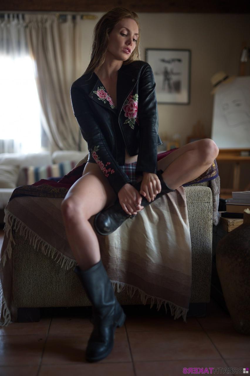 12P Glamour model Anuska bares a breast in tartan underwear and biker boots