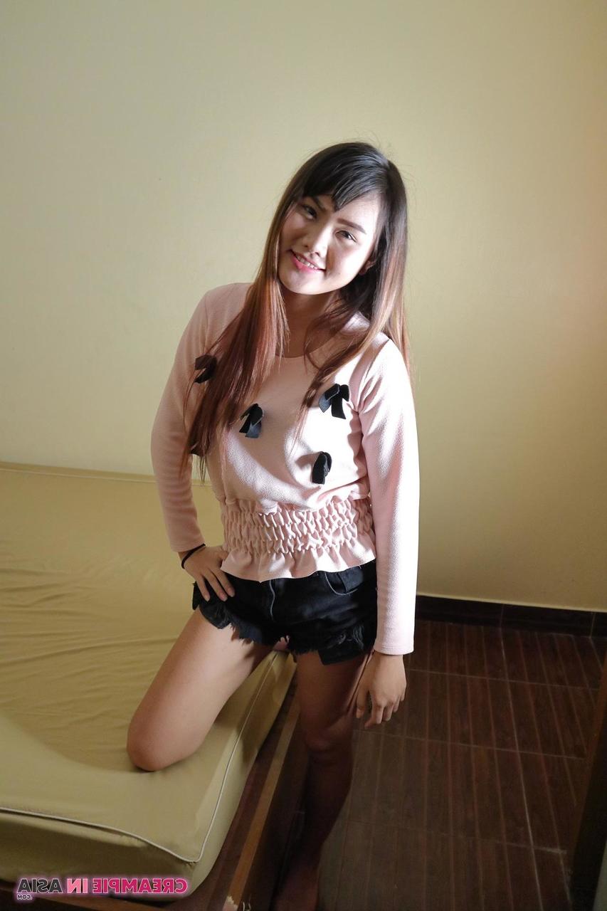 20P Attractive Asian babe Meu strips & flaunts her big ass and shaved pussy