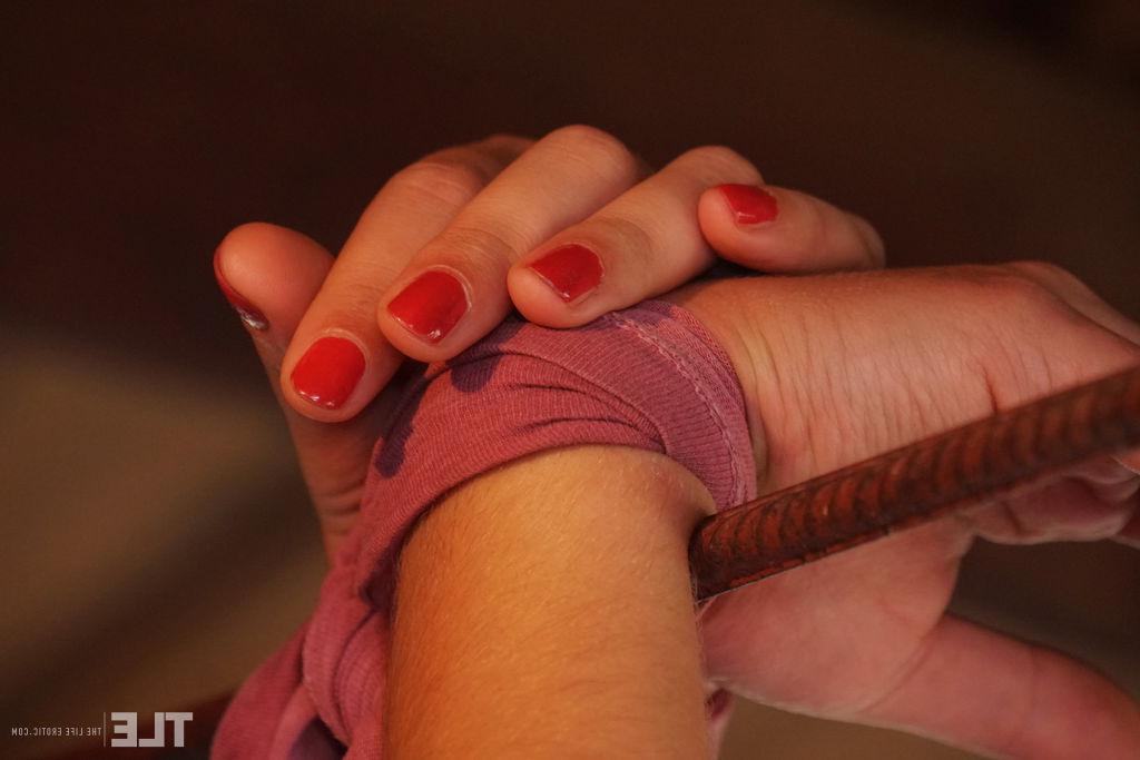 16P Nice teen Ursula B is restrained before fingering her trimmed bush