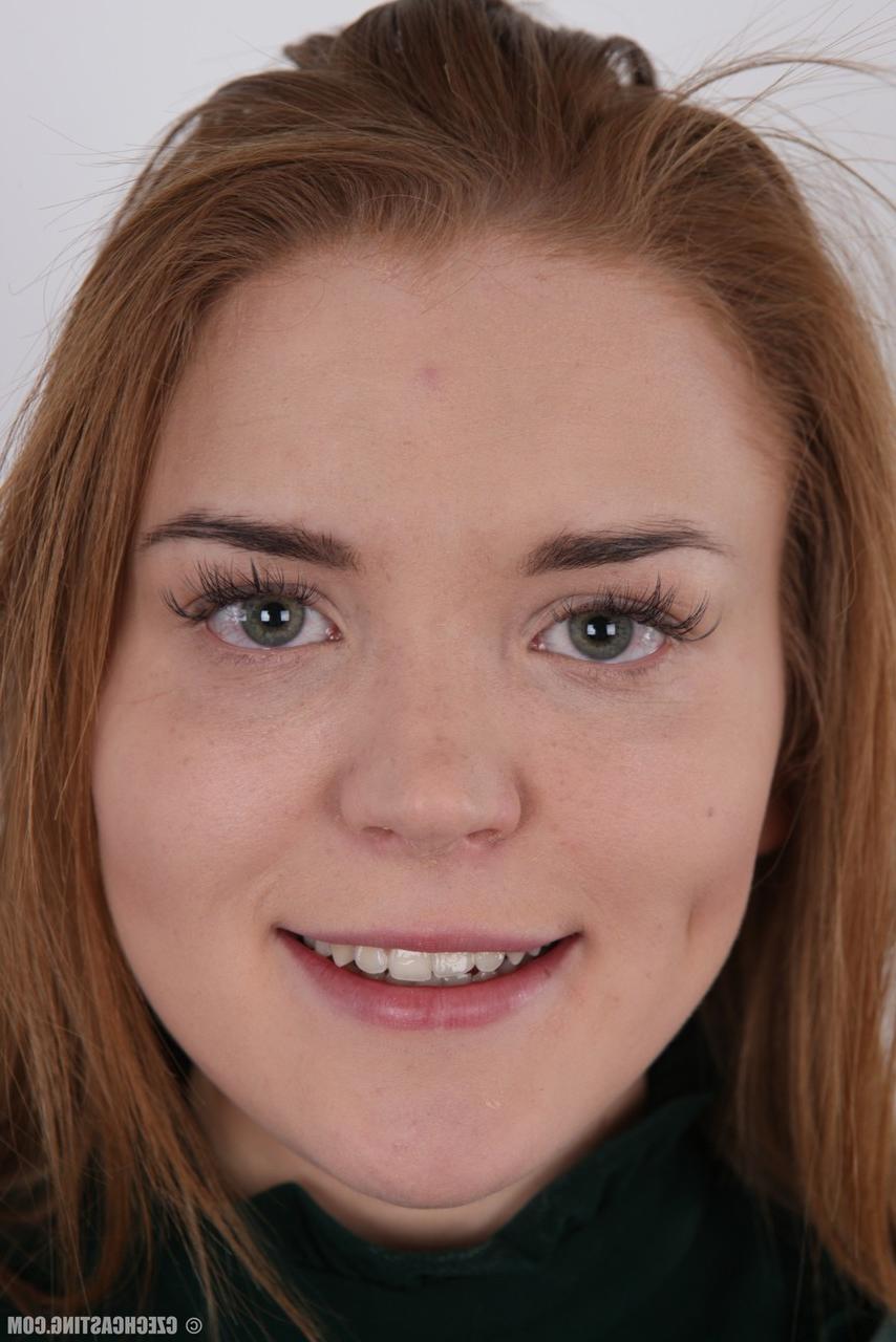 20P Chubby amateur Natalie stands fully clothed before doing the same while naked