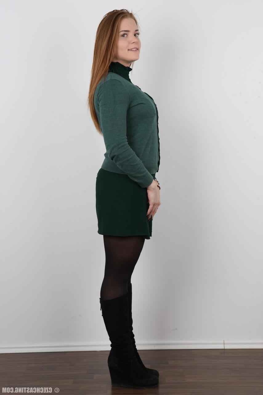 20P Chubby amateur Natalie stands fully clothed before doing the same while naked
