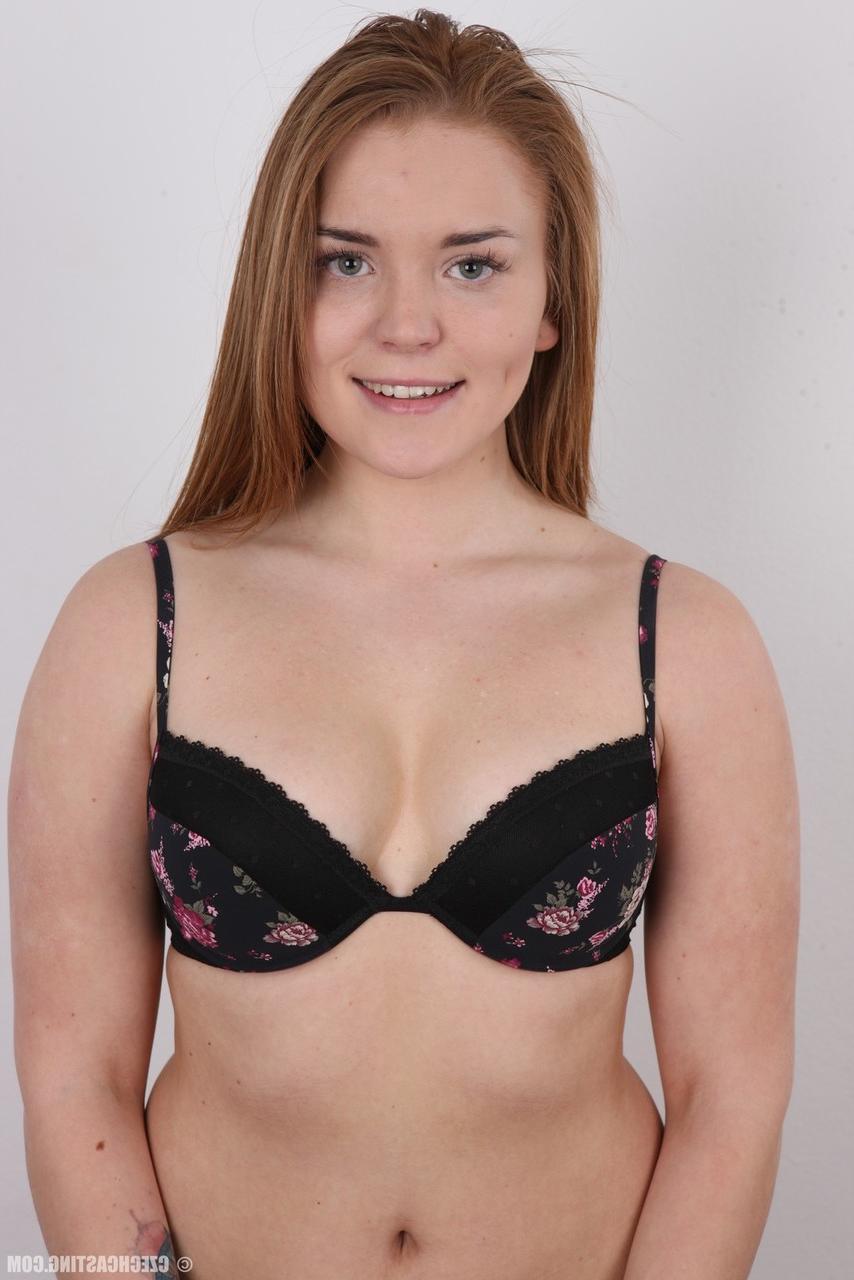 20P Chubby amateur Natalie stands fully clothed before doing the same while naked