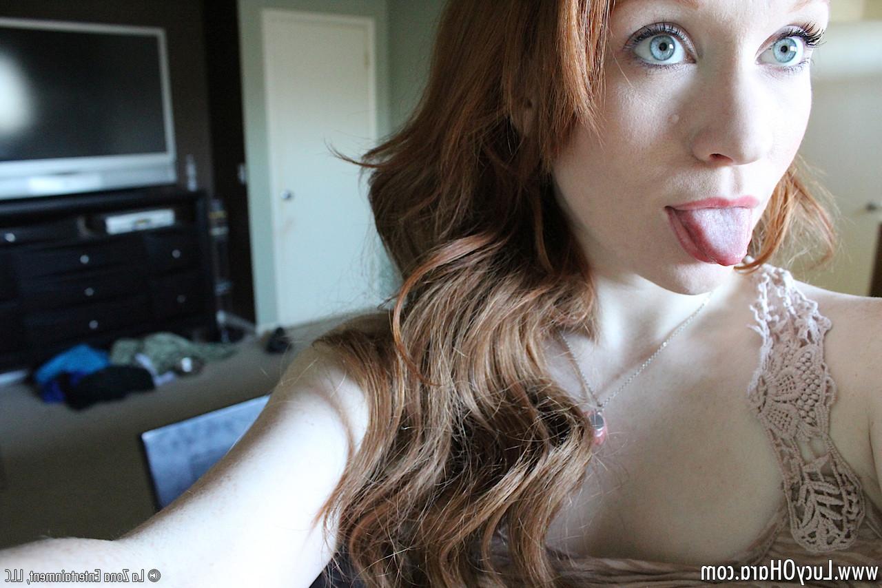 15P Pale redhead Lucy OHara takes selfies while fooling around on her bed on day