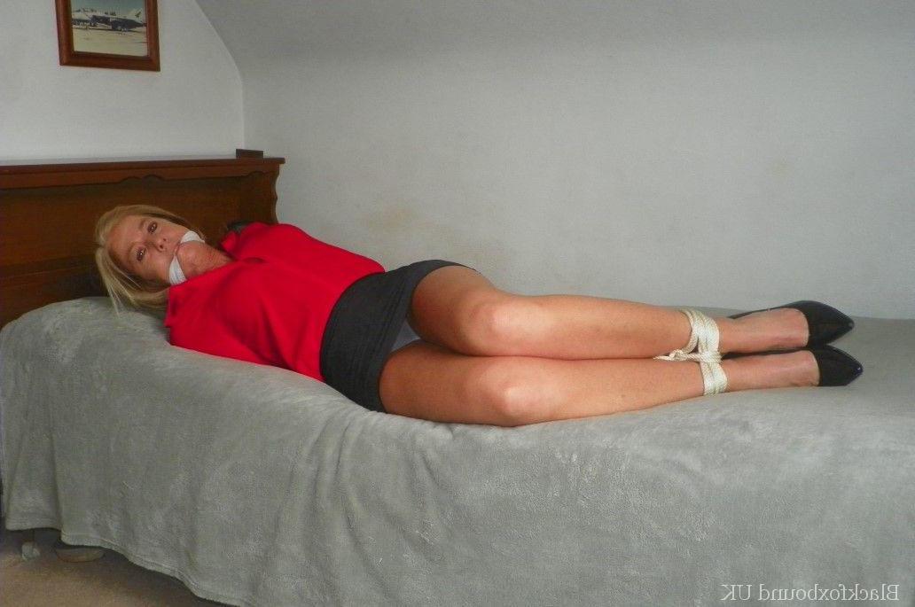 16P Blonde female ends up hogtied on a bed while cleave gagged in her clothes
