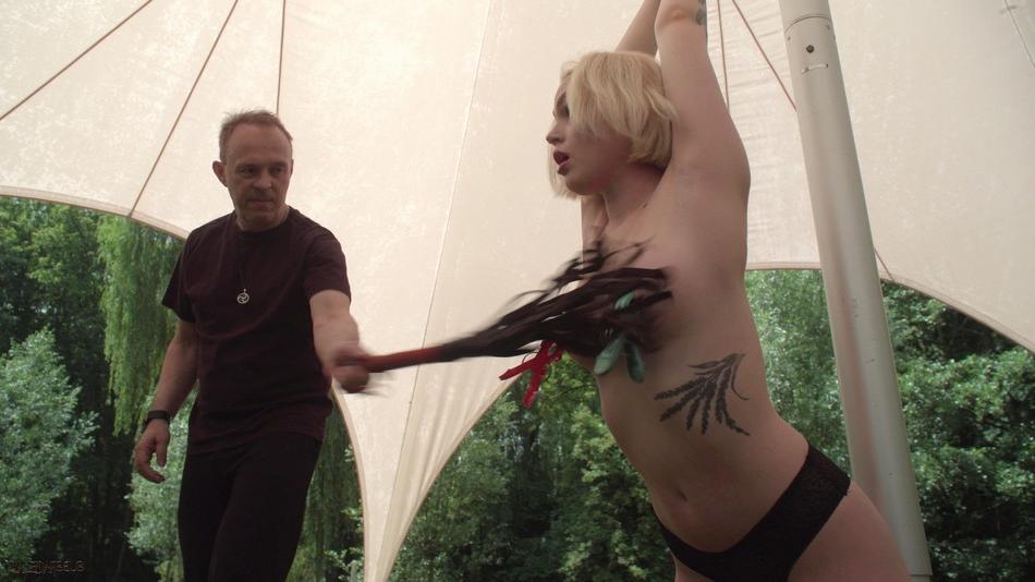 15P Submissive blonde is worked over by a sadist in a yard before giving a BJ