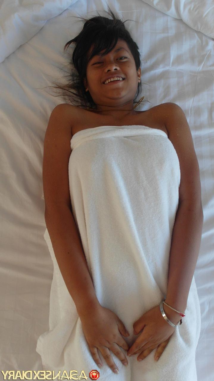 18P Beautiful Asian babe Paw shows her trimmed puffy pussy up close