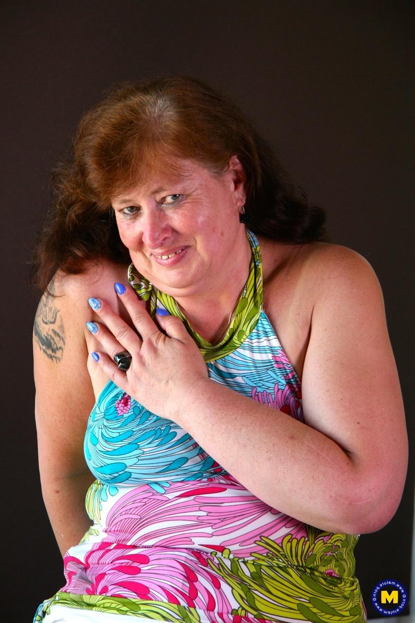 20P Dutch BBW Chantal A spreads her pussy during a flirty striptease on her bed