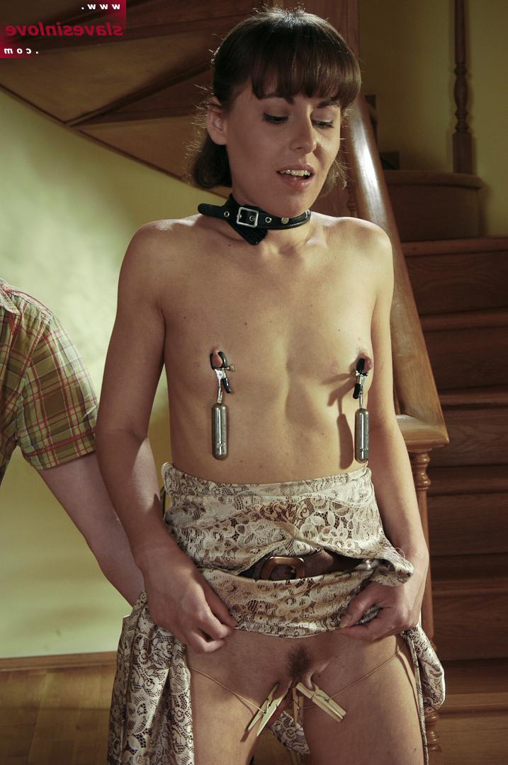 14P Female slave grimaces while being tortured prior to giving oral sex