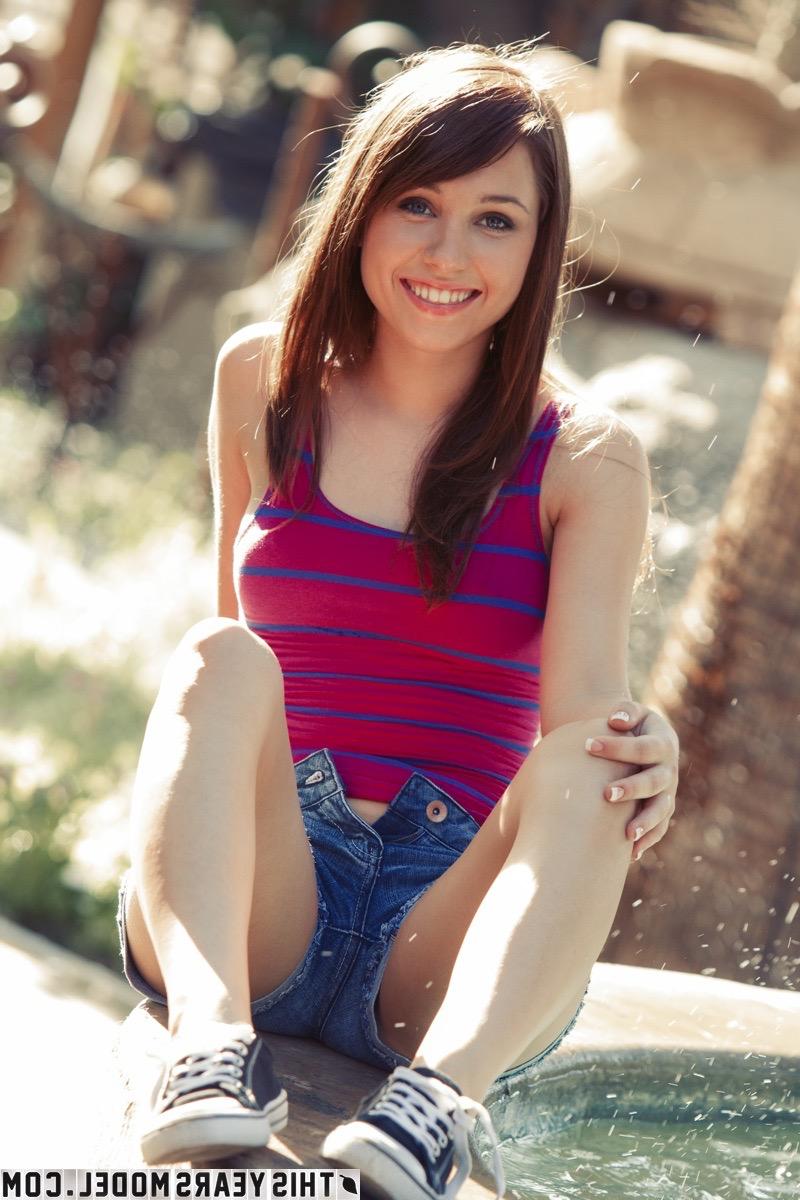 15P Pretty girl Marissa May splashes in the water while getting bare naked
