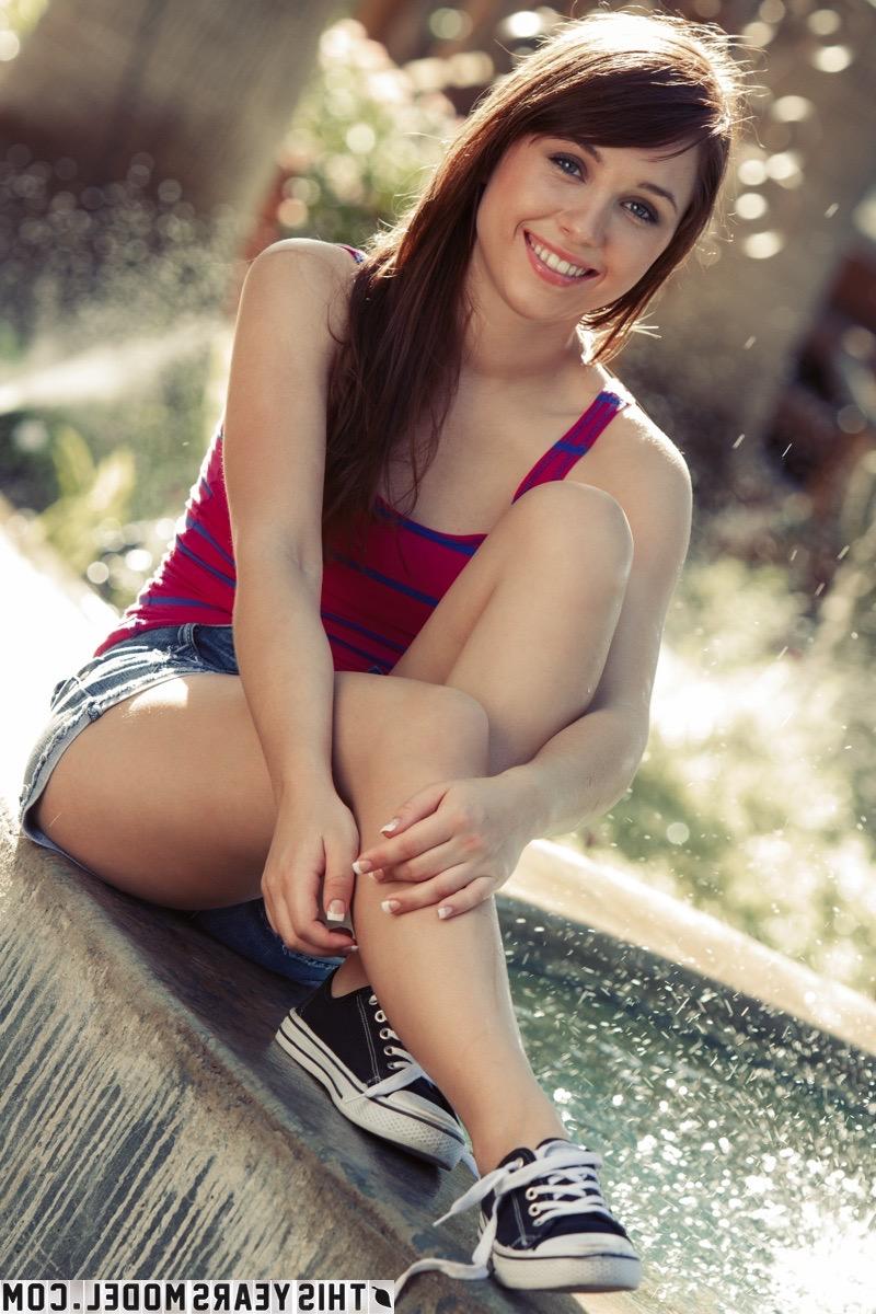 15P Pretty girl Marissa May splashes in the water while getting bare naked