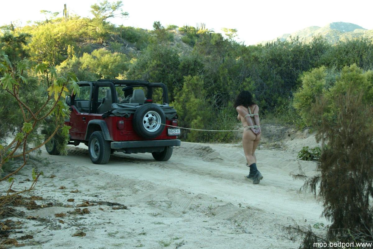 20P Bound & gagged MILF Jenya gets pulled behind a jeep & whipped by her sargeant