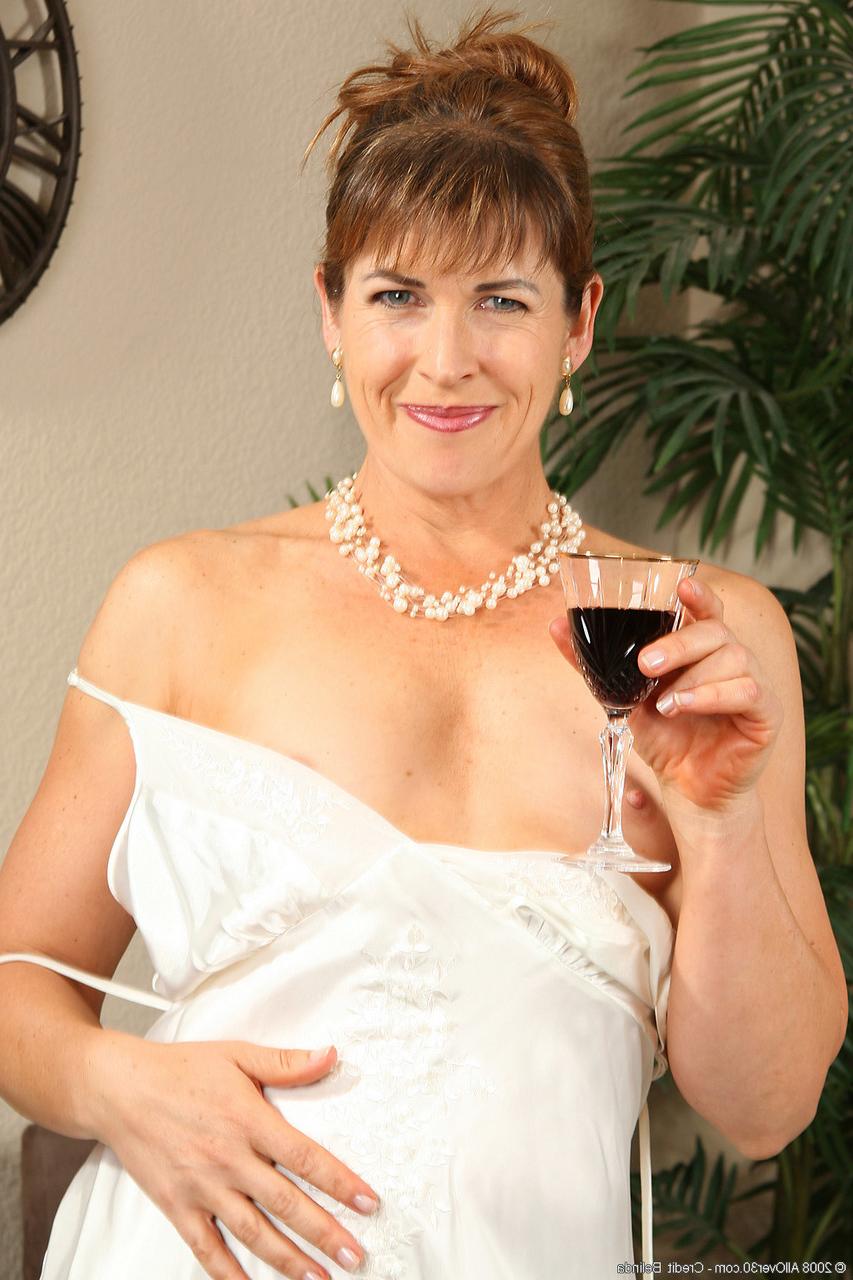 20P Gorgeous lady Andie stripping and flaunting her mature hairy pussy