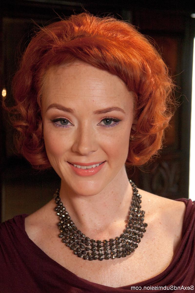 20P Redhead MILF Audrey Hollander teases a stud with her perky boobs in stockings