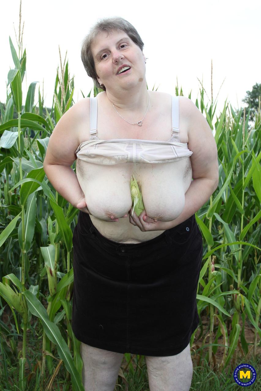 20P Plump European Tina C undresses in a corn field & masturbates her mature cunt