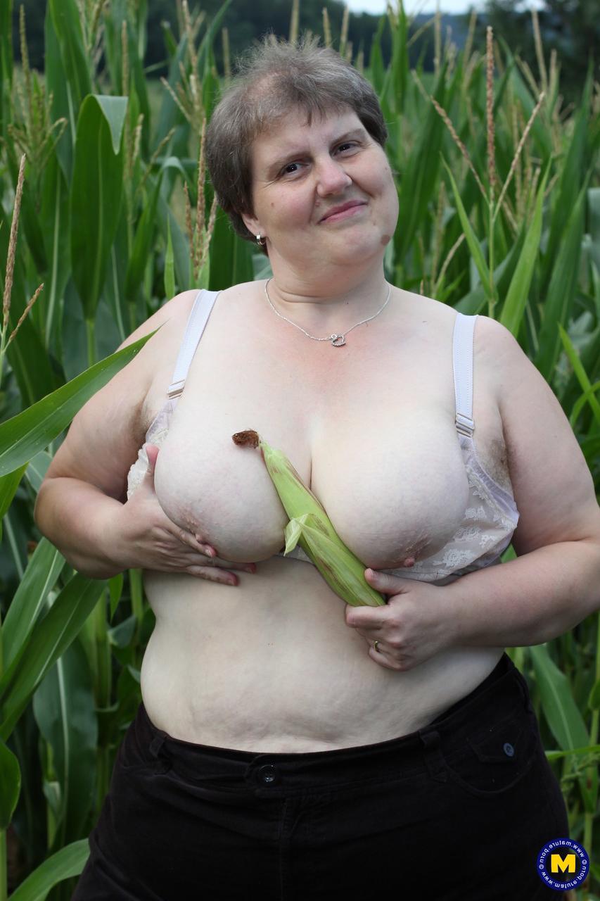 20P Plump European Tina C undresses in a corn field & masturbates her mature cunt
